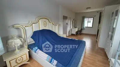 Spacious bedroom with elegant bed and natural light