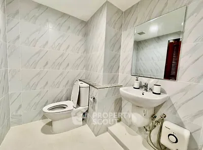 Modern bathroom with sleek fixtures and elegant tile design, perfect for a contemporary home.