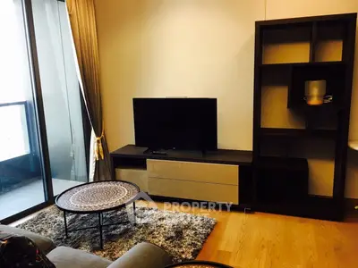 Modern living room with stylish furniture and balcony view