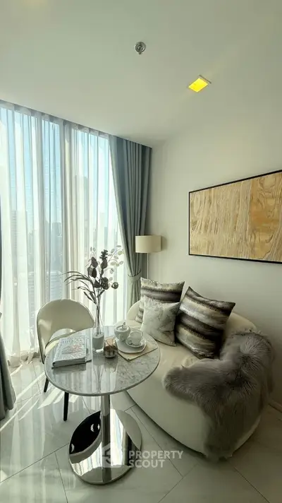 Elegant living room with modern decor and natural light