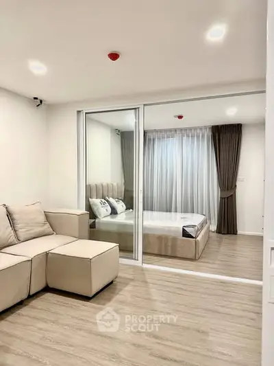 Modern apartment interior with cozy living room and elegant bedroom