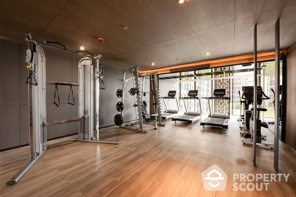 Modern gym with state-of-the-art equipment in luxury residential building