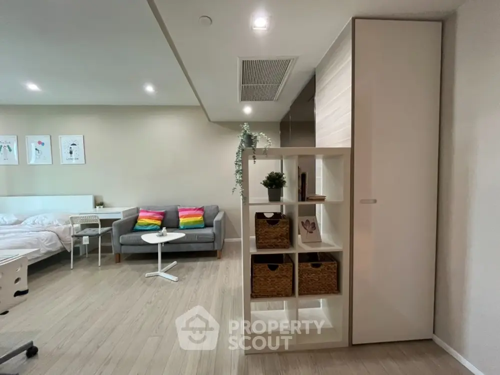 Modern studio apartment with cozy living area and stylish decor