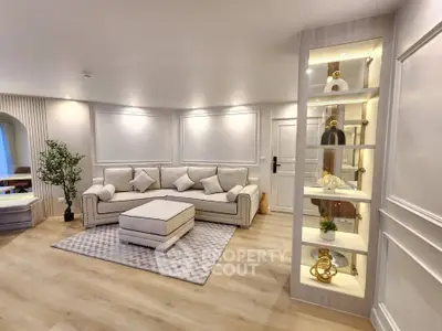 Elegant living room with modern decor and cozy seating area