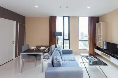 Modern living room with stylish furniture and city view, perfect for urban living.