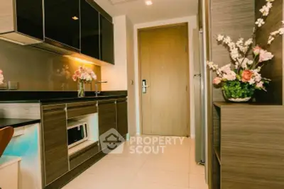 Modern kitchen with sleek cabinets and elegant floral decor