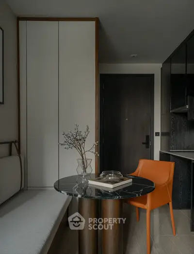 Modern interior with sleek furniture and stylish decor in a compact living space.