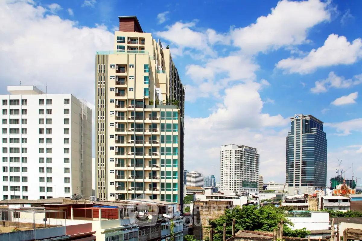 Stunning cityscape view featuring modern high-rise buildings under a clear blue sky.