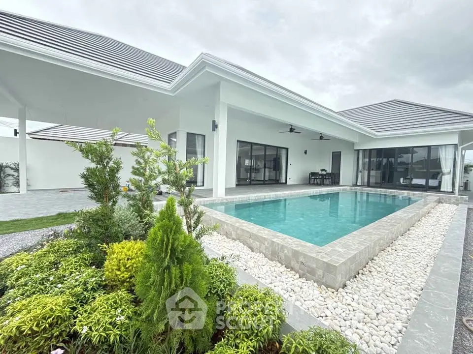 Luxurious modern villa with private pool and lush garden, perfect for serene living.