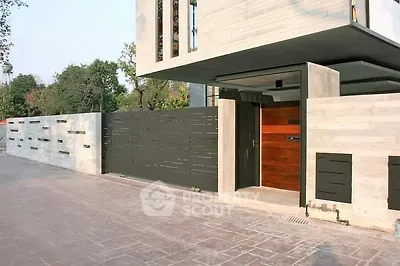 Modern architectural entrance with sleek design and contemporary materials.