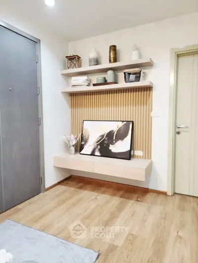 Modern interior with stylish shelving and artwork in a cozy living space.