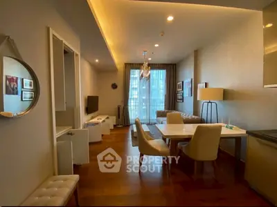 Elegant living room with modern decor and large window view
