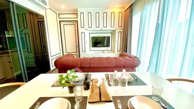 Luxurious living room with elegant decor and modern amenities in a stylish apartment.