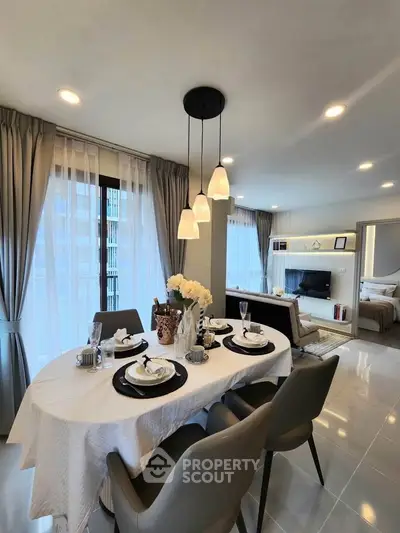 Elegant dining area with modern decor and natural light in a stylish apartment