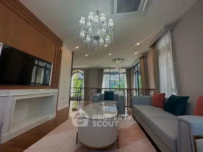 Luxurious living room with elegant chandelier and modern decor