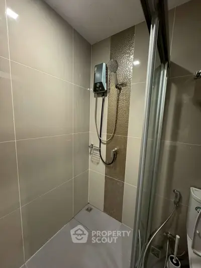 Modern bathroom with sleek shower and glass door enclosure