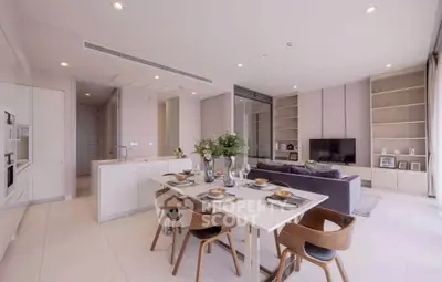Spacious modern living room with open kitchen and elegant dining area, perfect for entertaining.