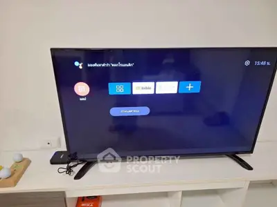 Modern living room with sleek TV setup on stylish console