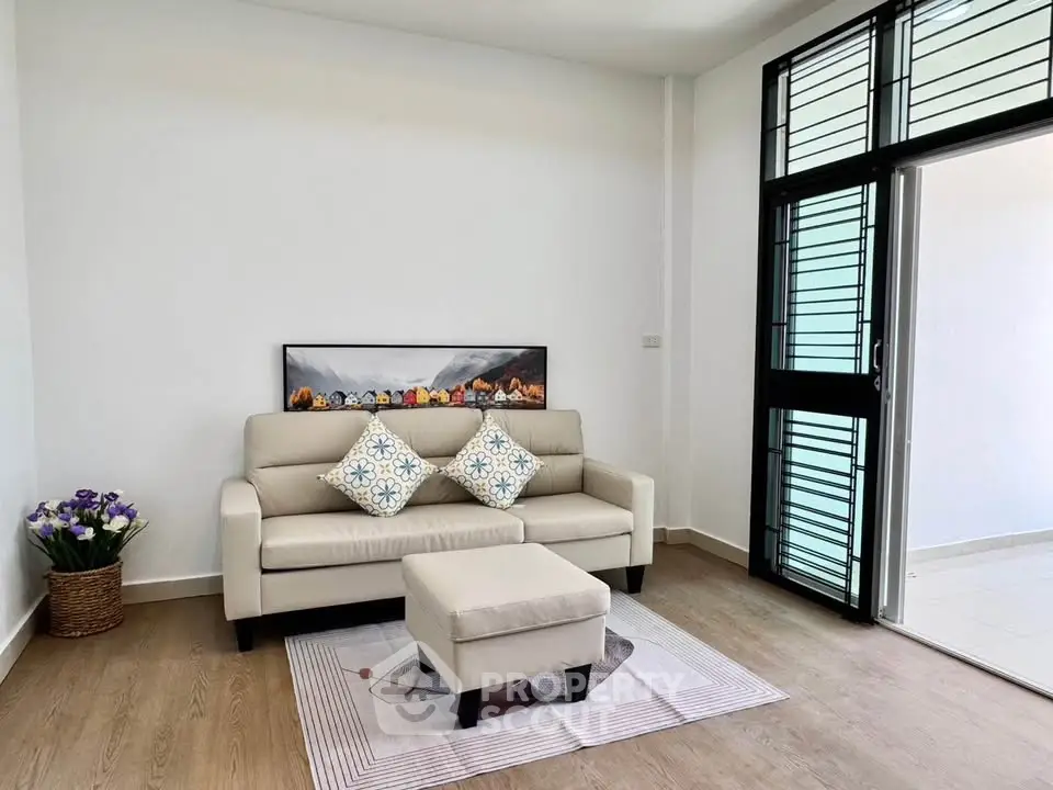 Chic modern living room with cozy sofa and stylish decor in bright apartment