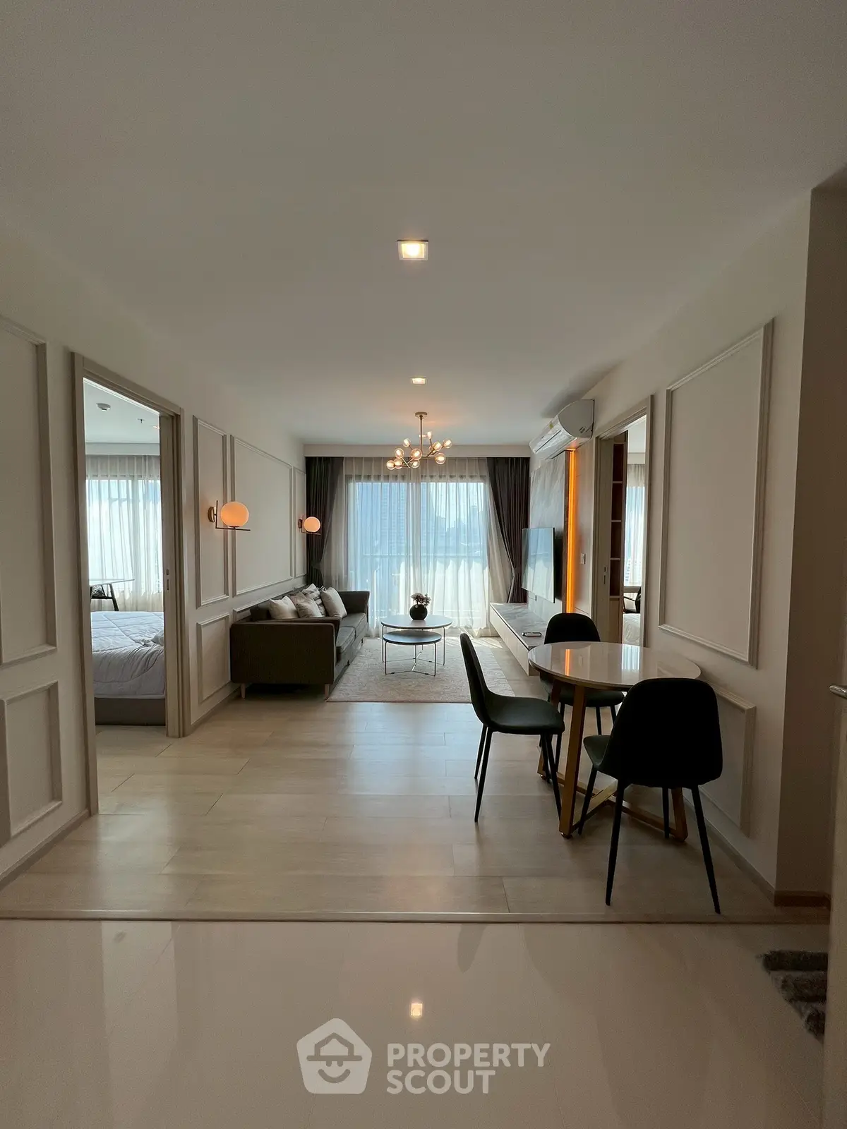 Spacious modern living room with elegant dining area and natural light