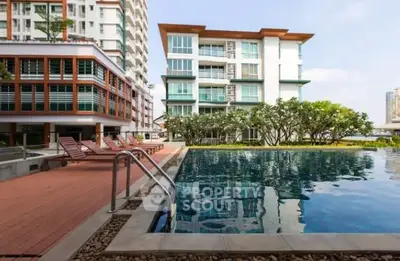 Luxurious apartment complex with pool and modern architecture