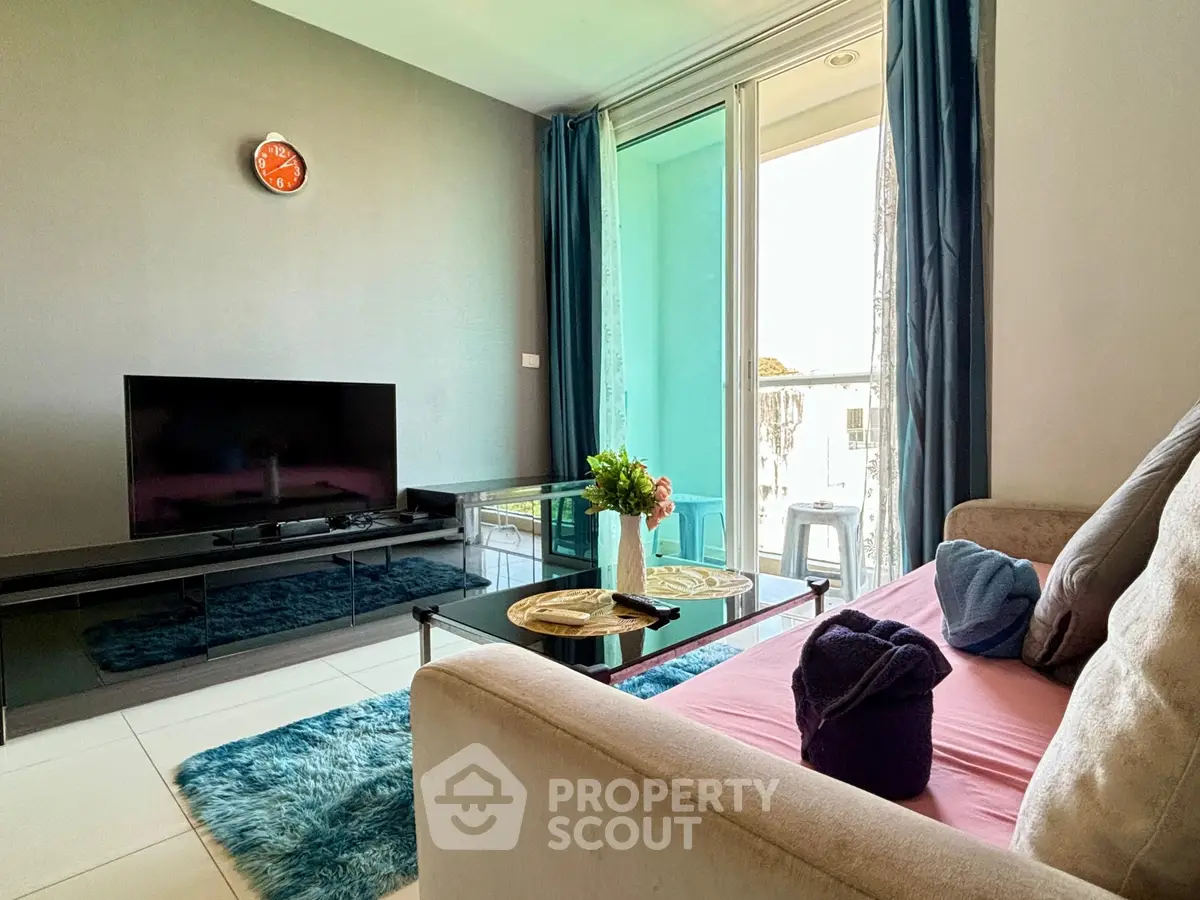 Modern living room with sleek TV setup and cozy decor