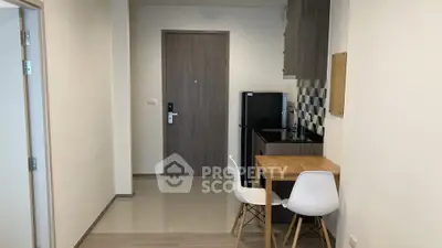 Modern compact kitchen with dining area in a cozy apartment
