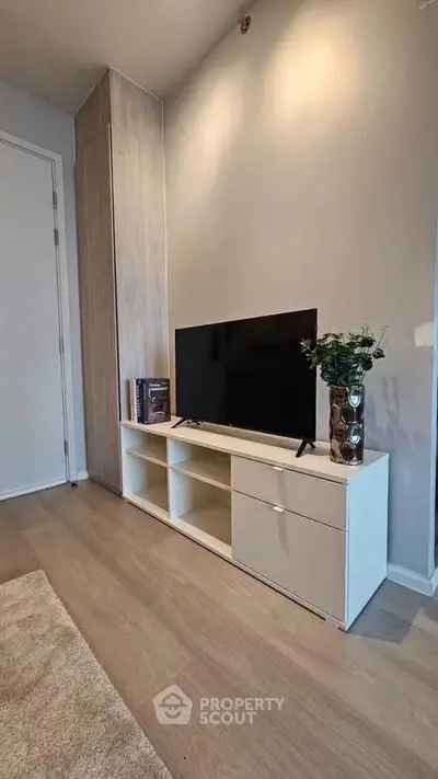 Modern living room with sleek TV stand and minimalist decor