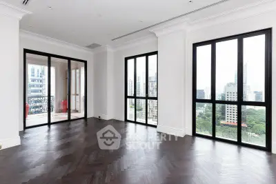 Spacious corner unit with floor-to-ceiling windows offering stunning city views.