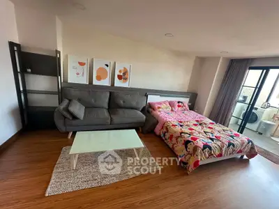 Spacious studio apartment with modern decor and balcony access