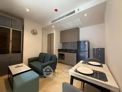 Modern open-plan kitchen and living room with sleek furniture and appliances