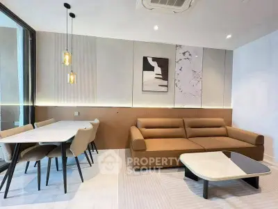 Modern living room with stylish furniture and elegant dining area