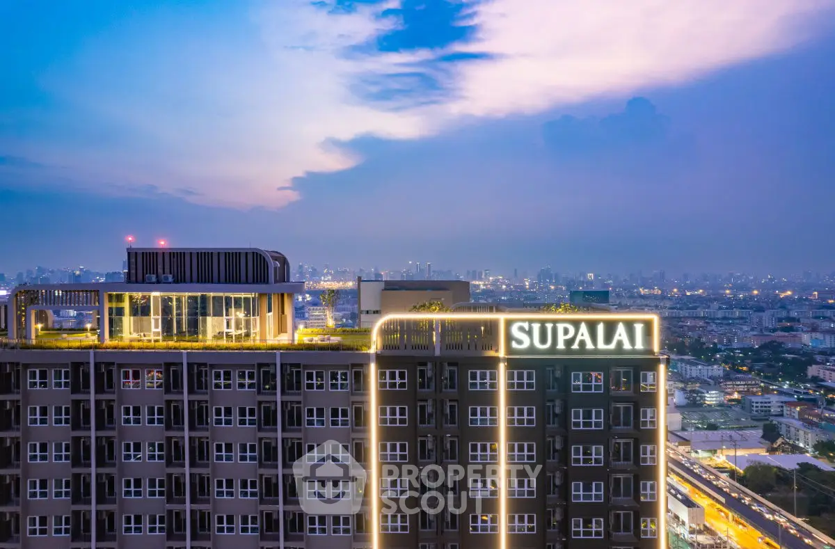 Stunning cityscape view of Supalai building at dusk with vibrant skyline.