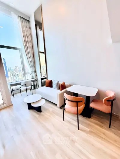 Modern living room with city view, featuring sleek furniture and floor-to-ceiling windows.