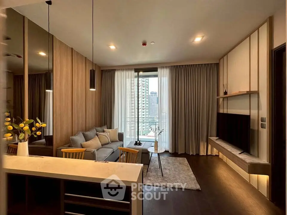 Modern living room with stylish decor and city view balcony in luxury apartment.