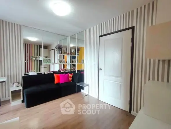 Stylish living room with striped wallpaper and modern decor