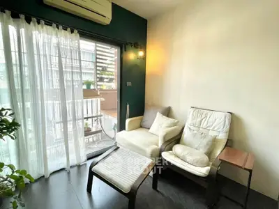 Cozy living room with balcony access and modern decor