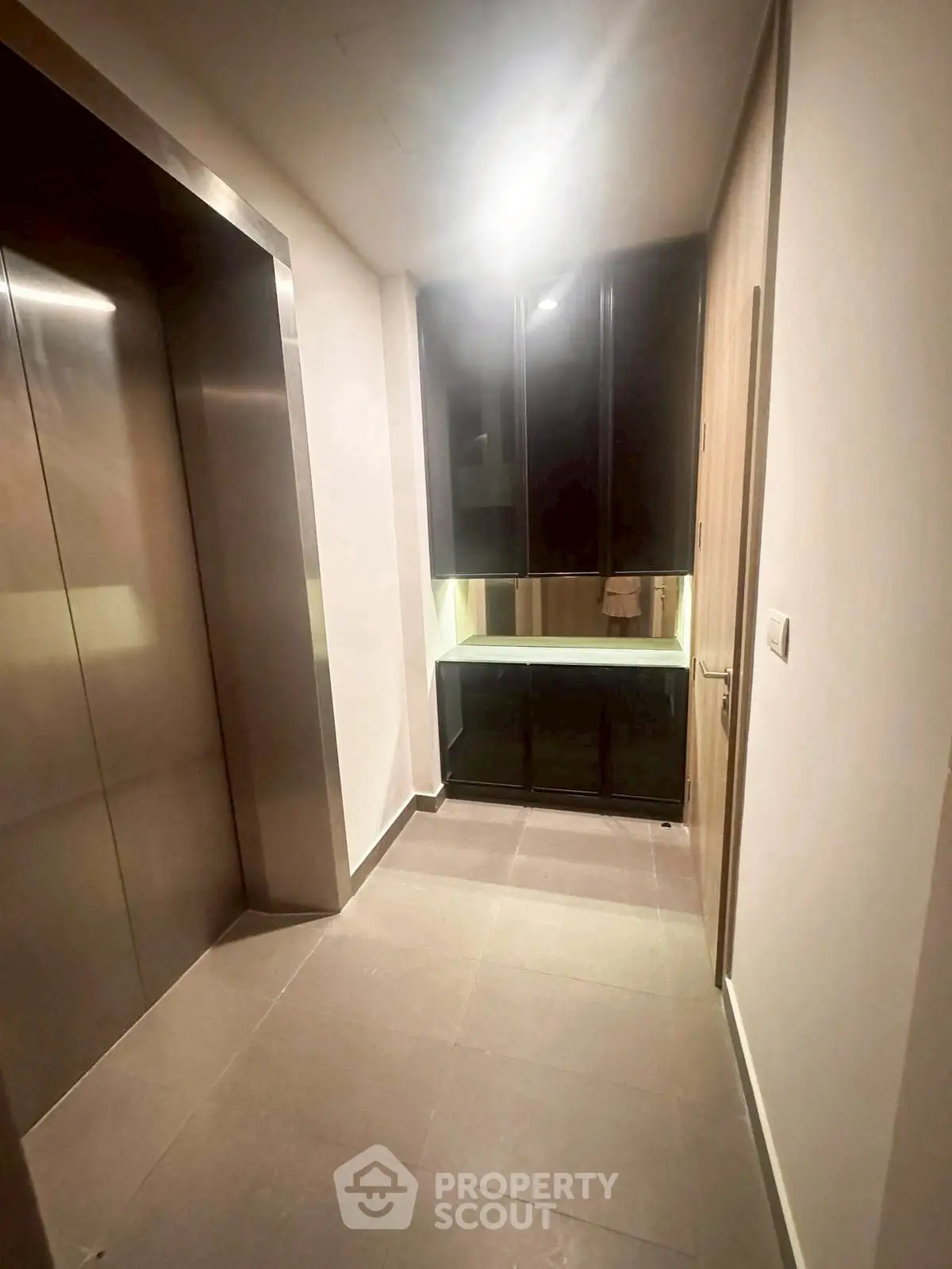 Modern apartment elevator area with sleek design and ambient lighting