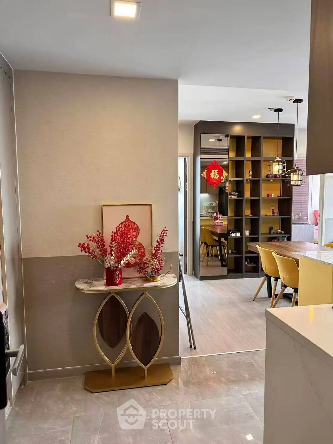 Modern open-layout kitchen and dining area with stylish decor and elegant lighting.