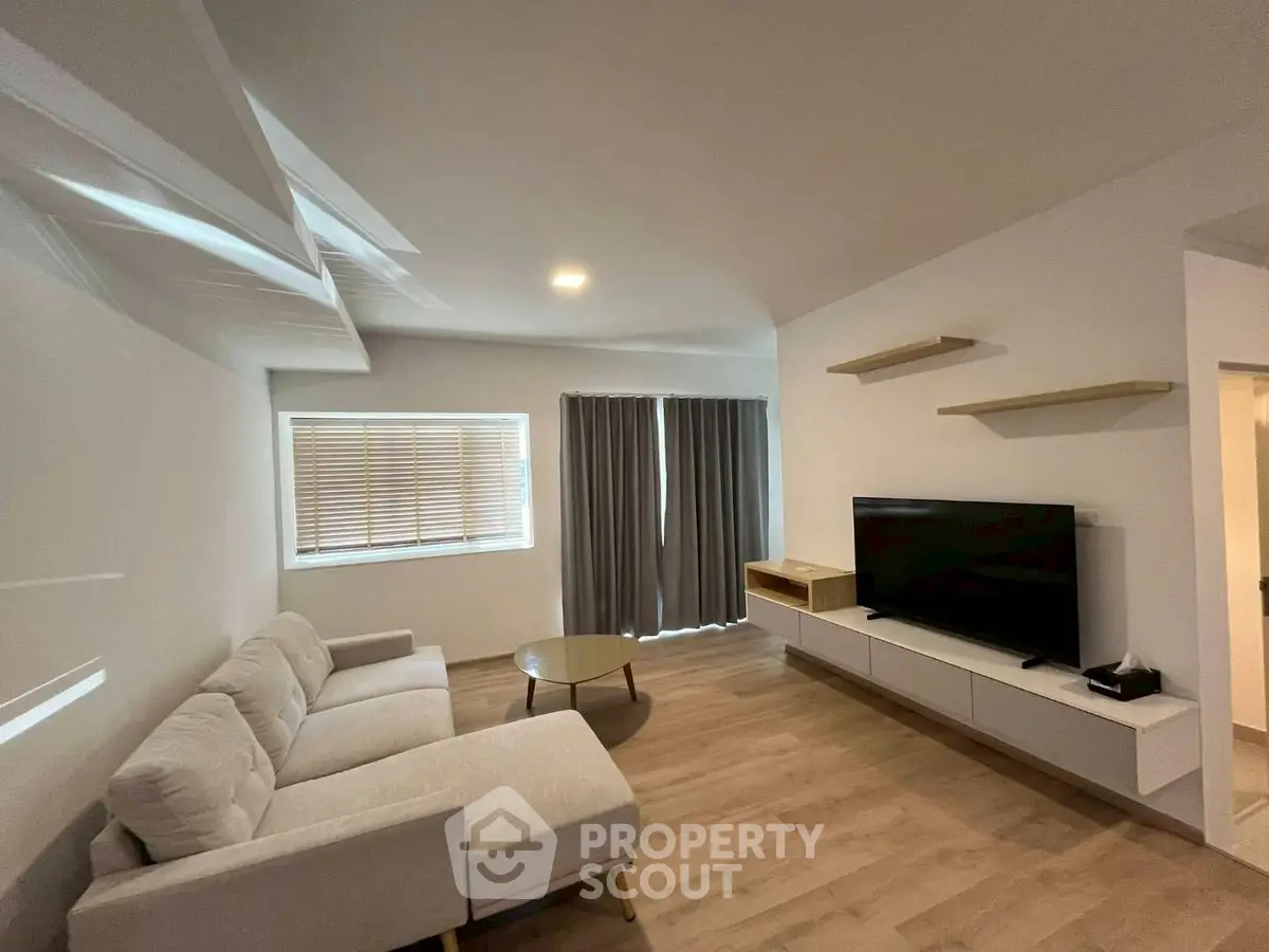 Modern living room with sleek furniture and natural light