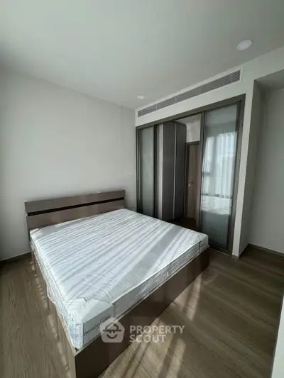 Modern bedroom with sleek design and ample natural light