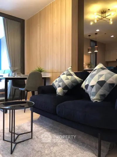 Modern living room with stylish decor and cozy seating area, perfect for relaxation and entertaining.