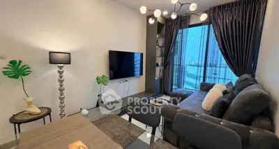 Modern living room with chic decor and large window view