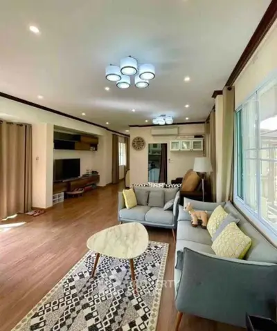 Spacious living room with modern decor and ample natural light