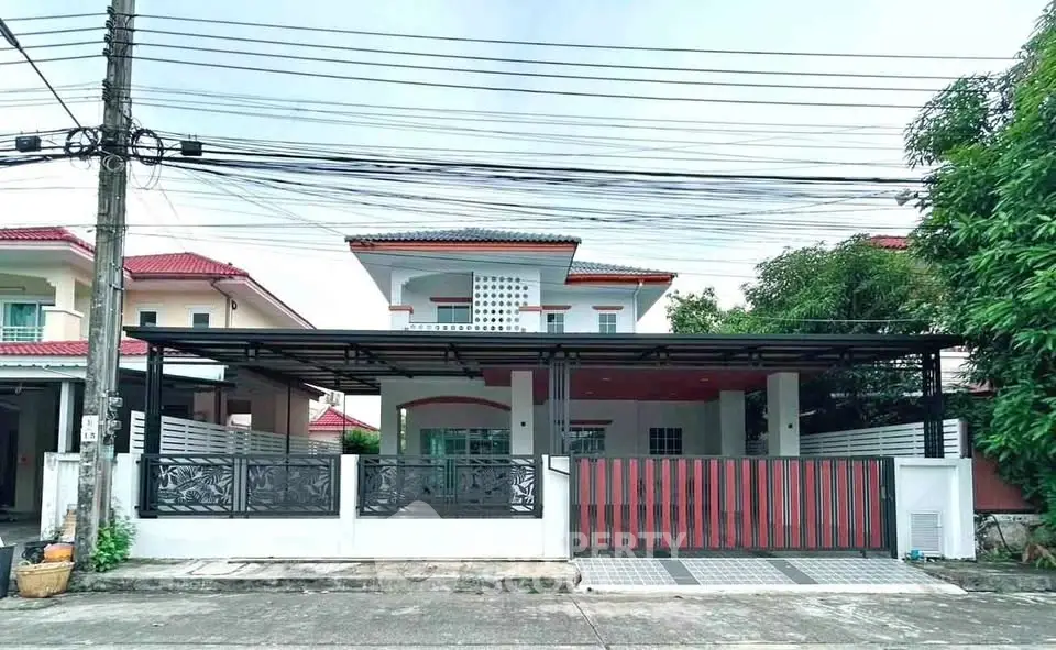 Charming two-story house with modern facade and spacious driveway in a serene neighborhood.