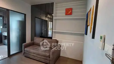Cozy living room with modern decor and comfortable sofa in a stylish apartment.