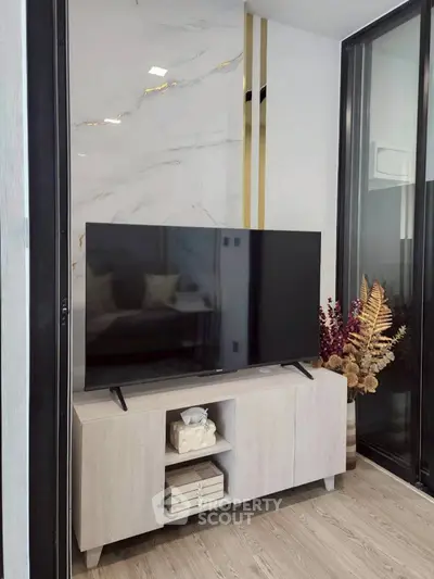 Modern living room with sleek TV setup and elegant decor