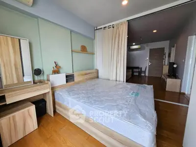 Spacious bedroom with modern wooden furniture and natural light