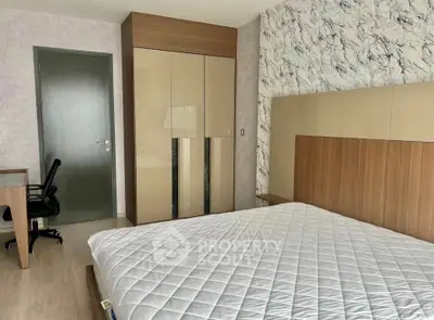 Modern bedroom with stylish decor and comfortable furnishings in a contemporary apartment.