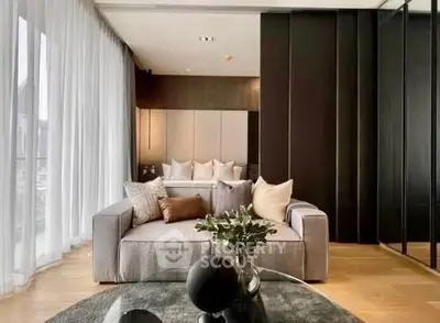 Luxurious modern living room with elegant decor and cozy seating area.
